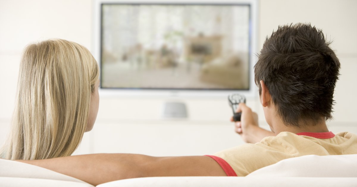 https://www.mediavillage.com/media/articles/couple-in-living-room-watching-television_rFZl3RBj.jpg.1200x630_q85_box-0%2c266%2c4992%2c2887_crop.jpg